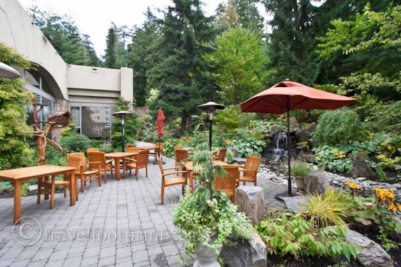 fairmont-chateau-whistler-hotel-outdoor-terrace-umbrella-tables-plants